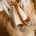 Champagne coloured women's wedding shoes with pointed toe, rhinestone details, and a fine heel.