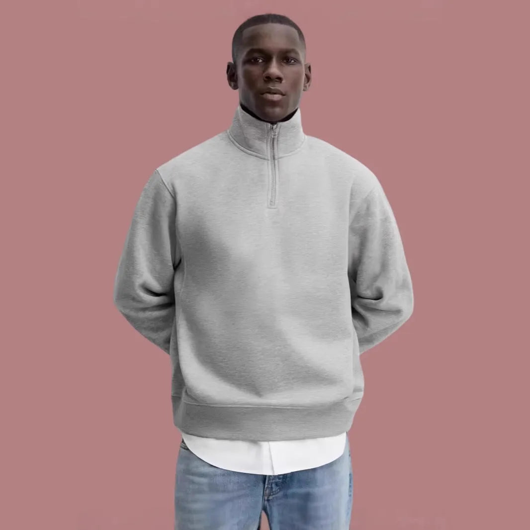 Grey half zipped stand collar cotton sweater hoodie for men and women on a hanger
