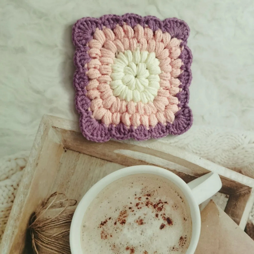 Crocheted wool cup placemat with Grandmother Lattice pattern in chosen colour