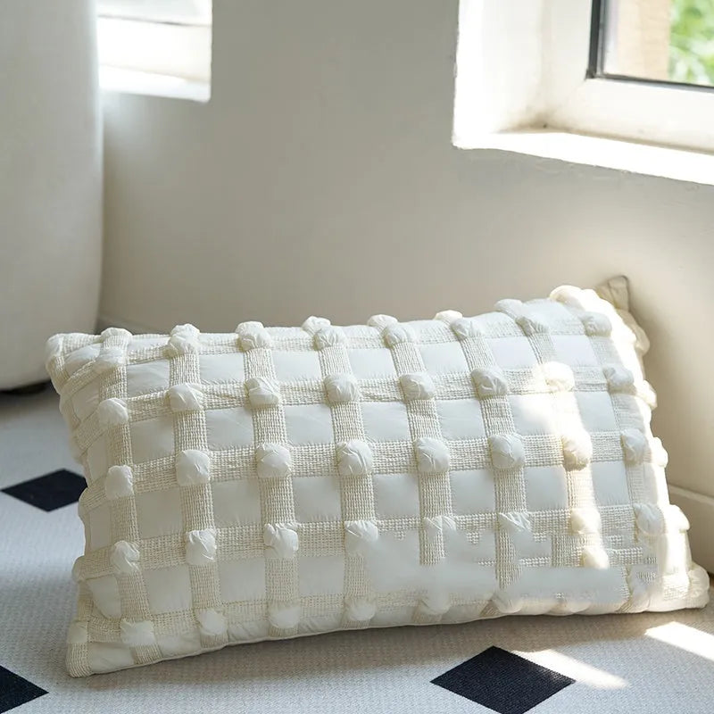 Coffee brown Chinese classical style cushion with striped and patchwork designs on a sofa.