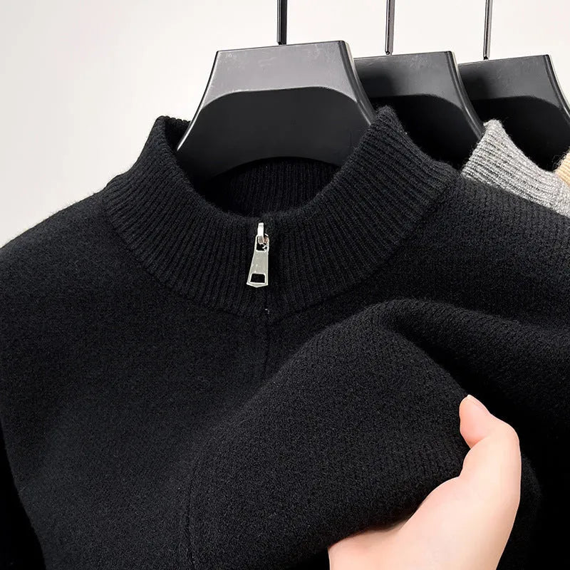 Men's black knitted zip-up cardigan with a stand collar, shown in a loose fit.