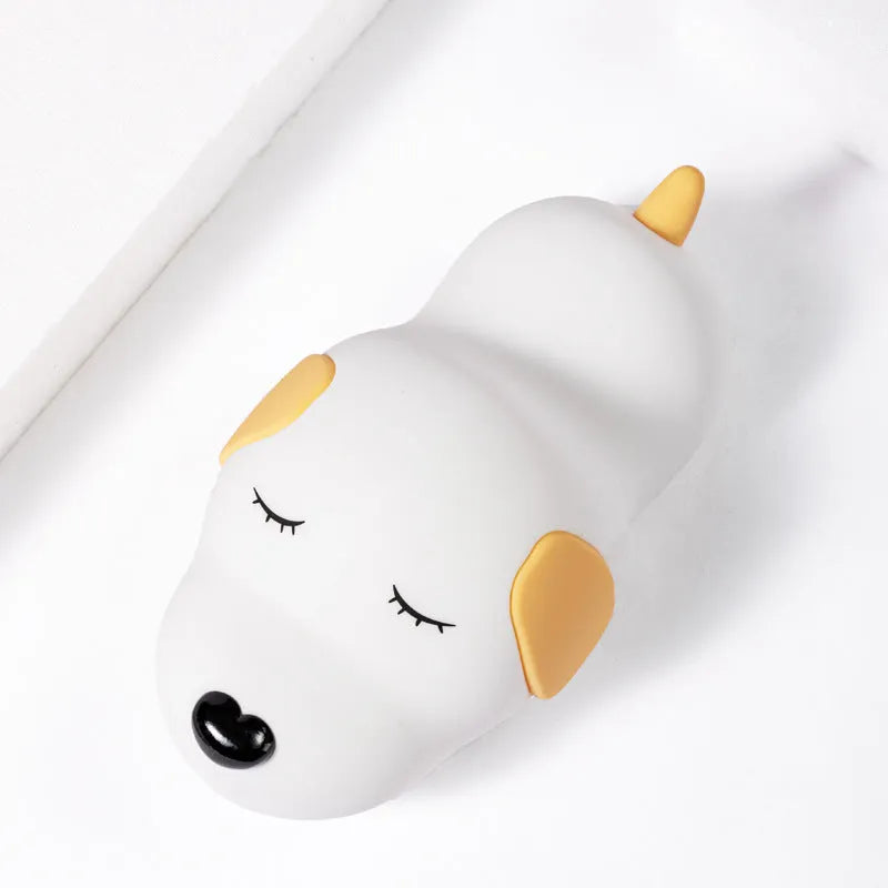 Silicone cartoon dog night light with two colours and a USB cable.