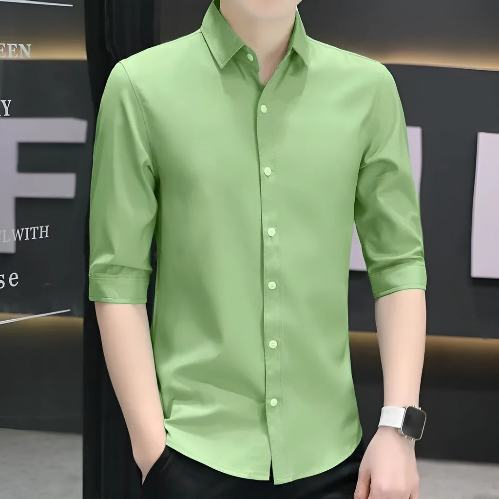 Men's slim-fit half-sleeve shirt in linen and silk blend, shown in grass green colour with non-ironing finish.