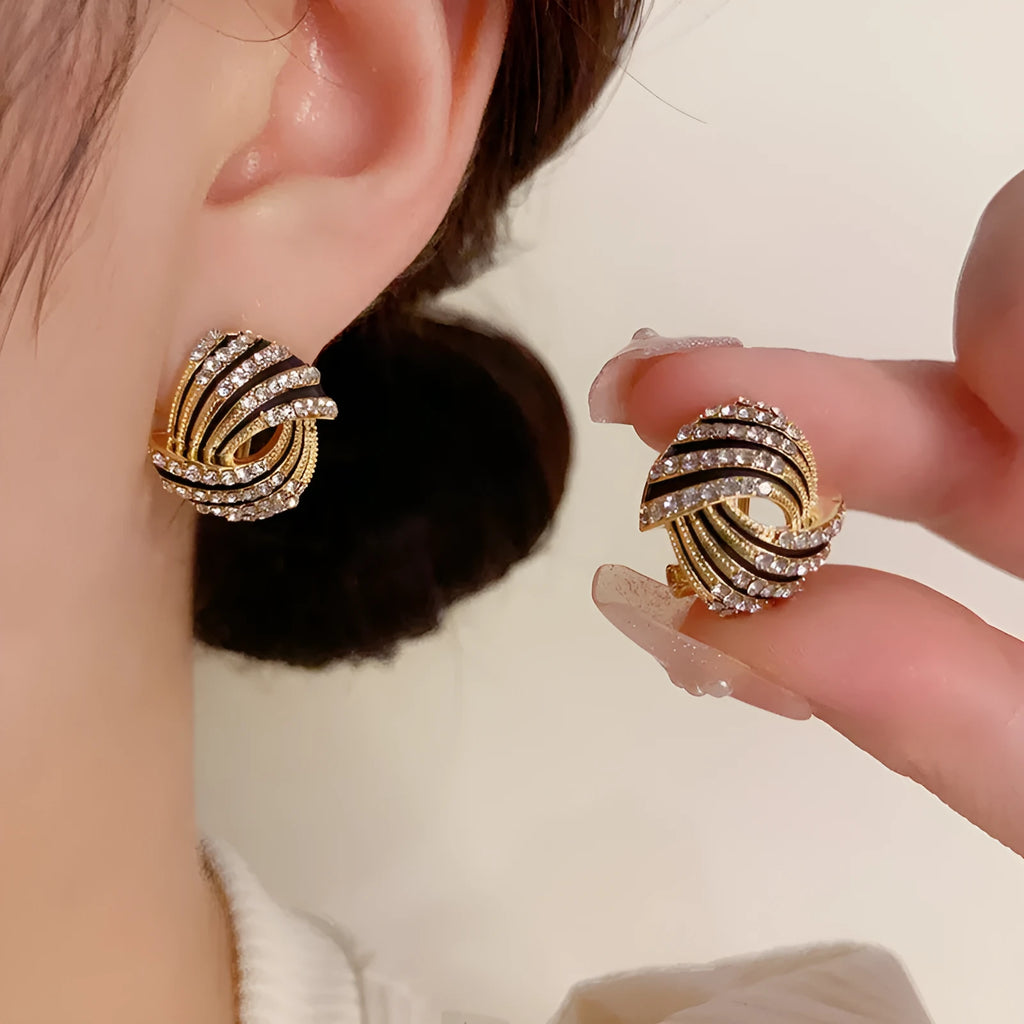 Gold plated rhinestone stud earrings with geometric ring shape and super-flash finish