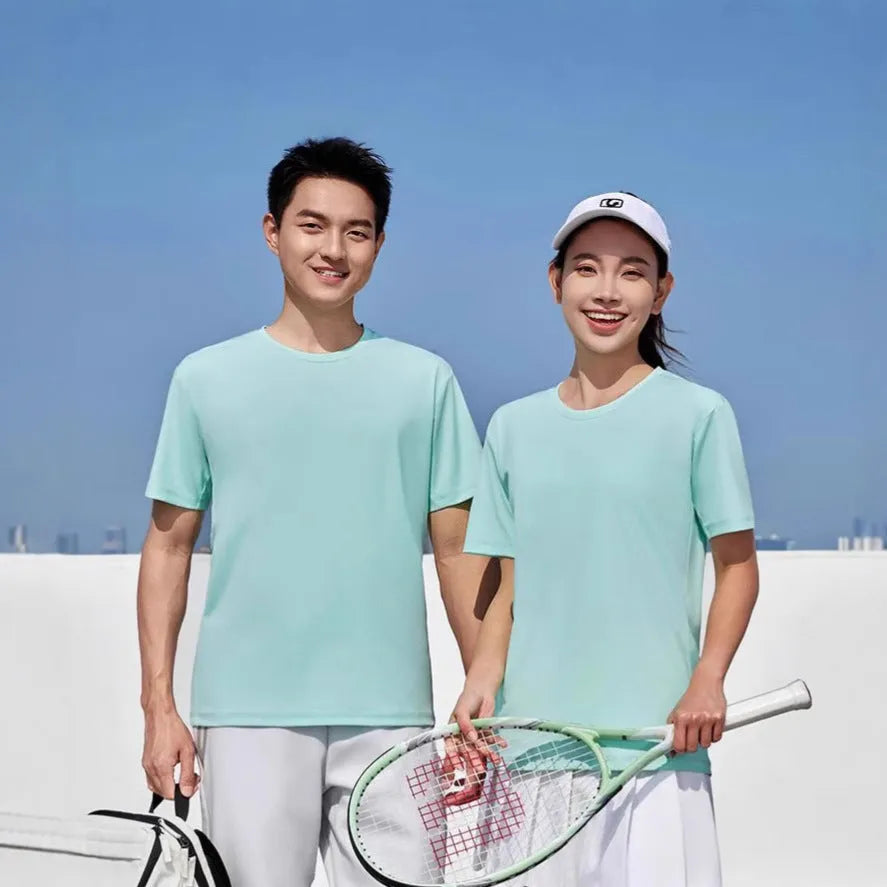 Men's loose fit solid colour polyester sports t-shirt on a hanger, showing short sleeves and casual cut.