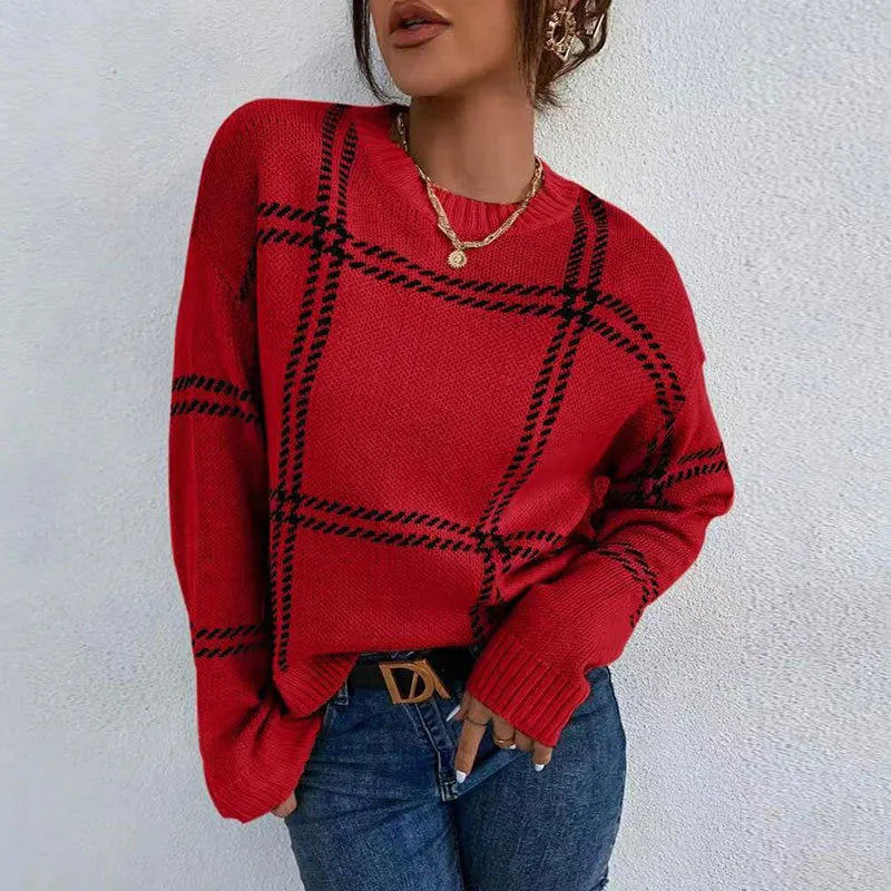 Women's loose fit plaid sweater with apricot, black, beige, red, and green colour-block stripes.