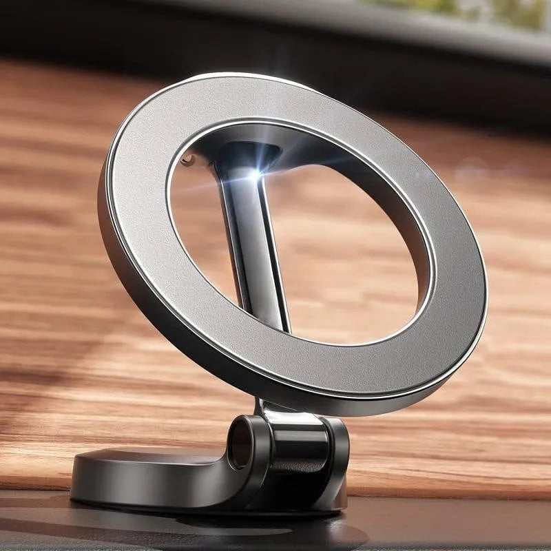 All-metal magnetic car phone mount in Qian colour on a car dashboard.