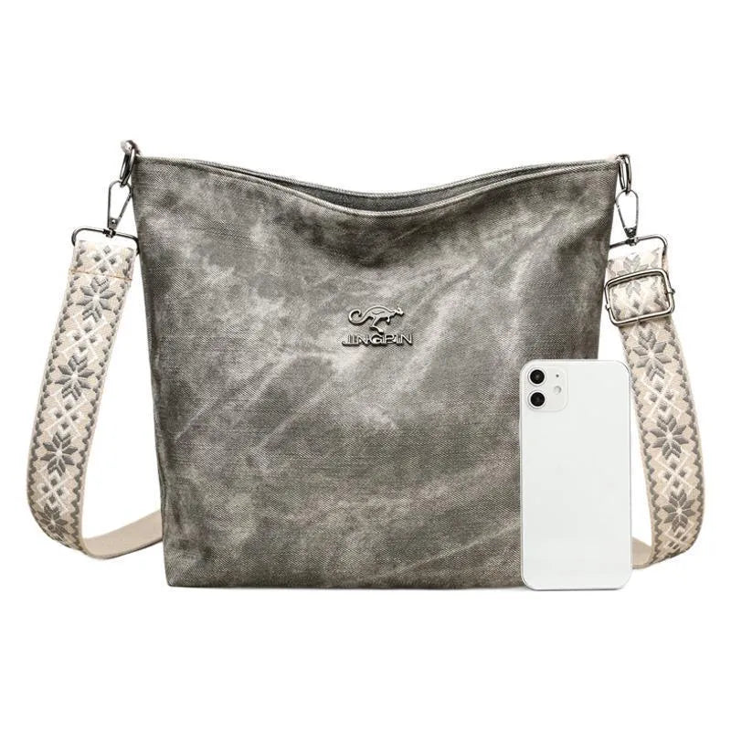 Soft PU leather women's crossbody bag in grey, pink, or yellow with an adjustable strap