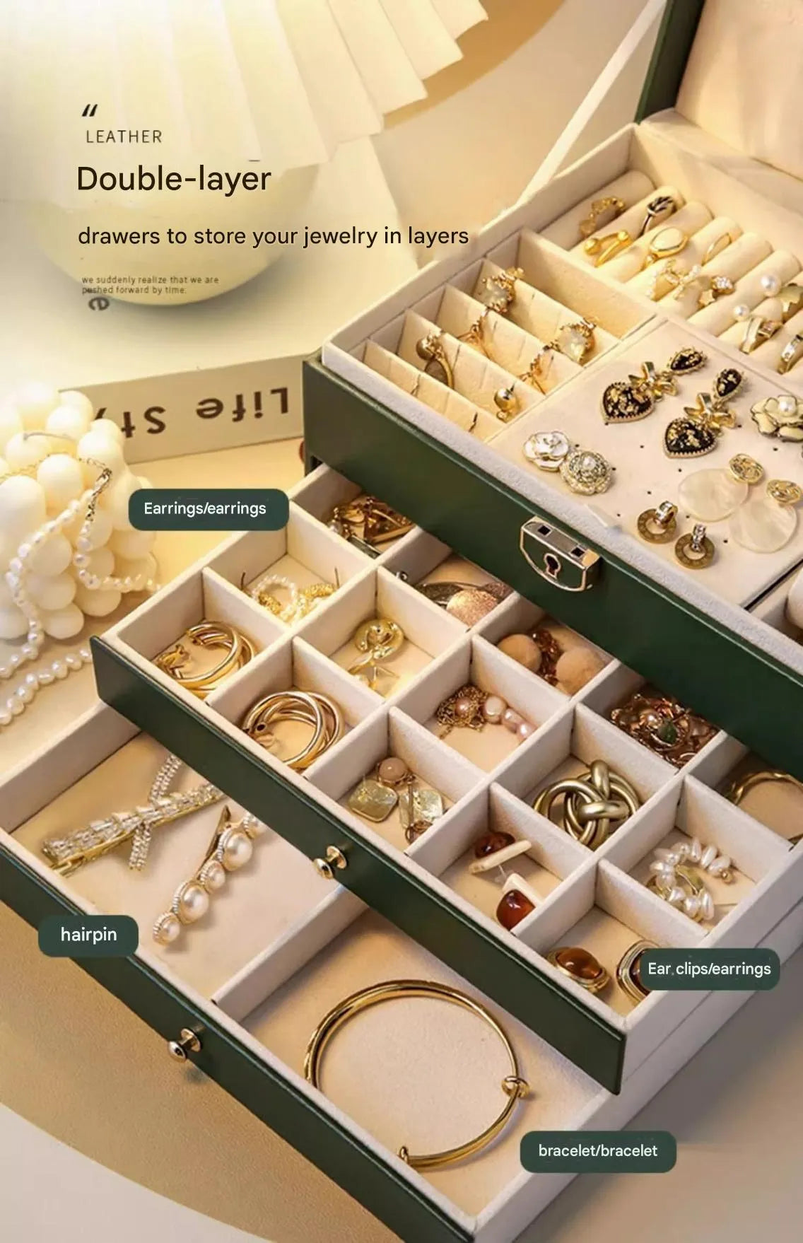 Leather jewellery box with three drawers open, showing storage for necklaces, earrings and bracelets.