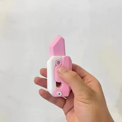 3D printed plastic gravity carrot knife fidget toy in orange, purple, and green colours.