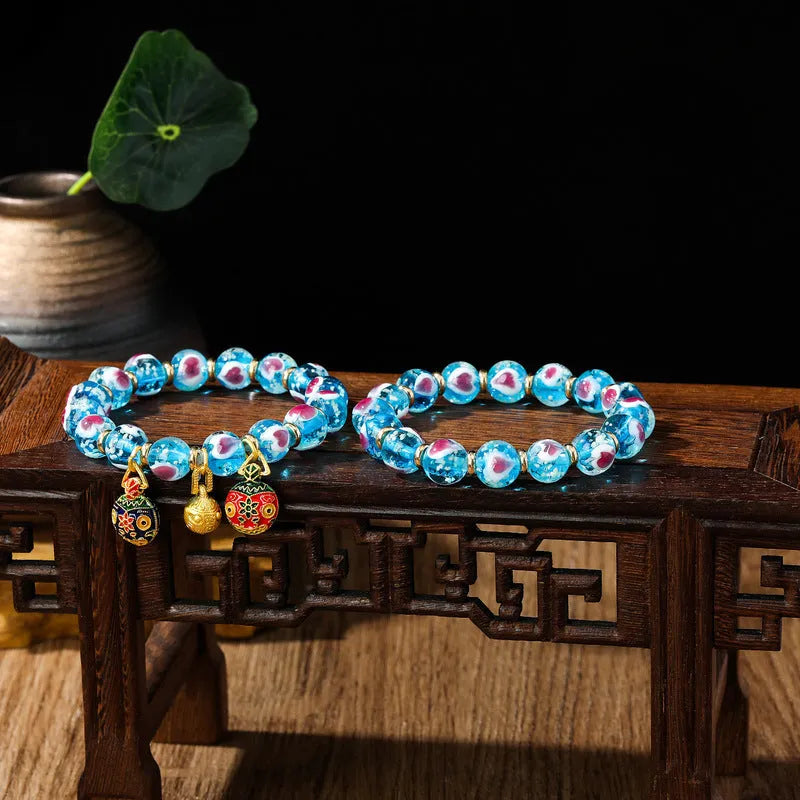 Handmade heart-shaped glass bracelet with swallowing gold beast pattern in ancient fluorescent glaze