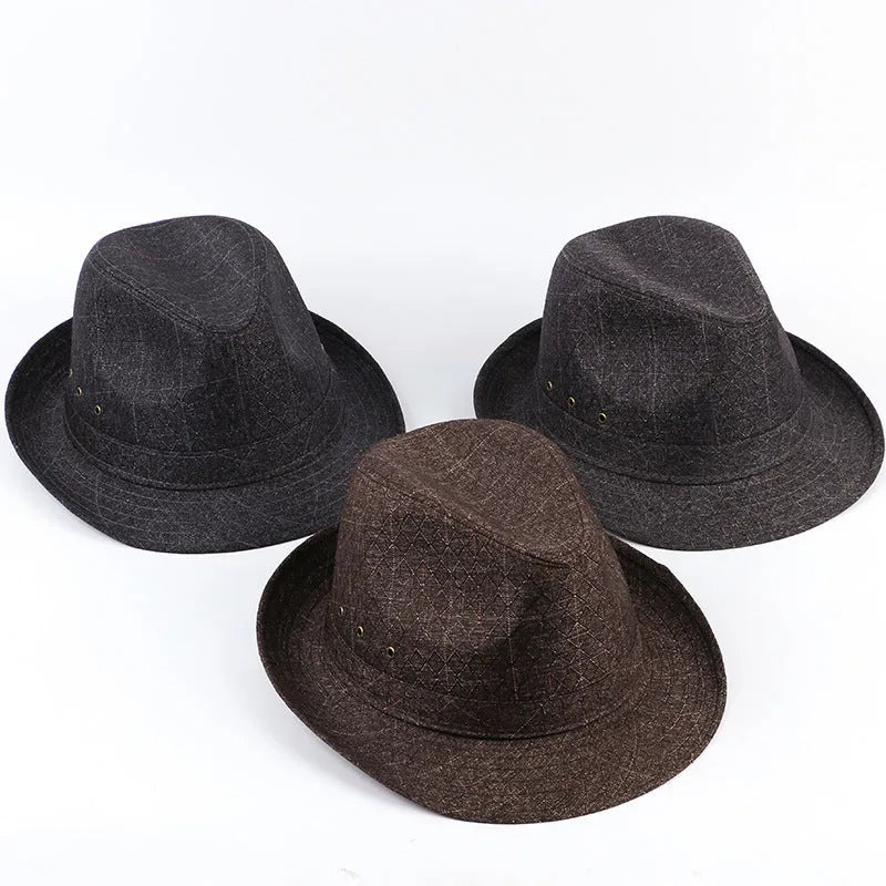 A classic brown fedora hat with a pinched crown and medium brim on a wooden table, showing its structured silhouette.