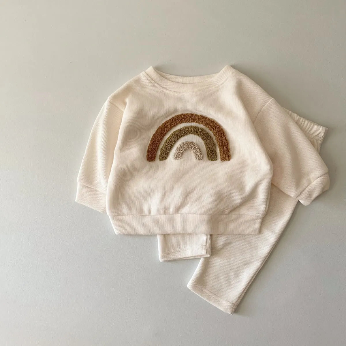 Creamy-white baby cotton two-piece suit with alphabet embroidery on long sleeve blouse and matching trousers