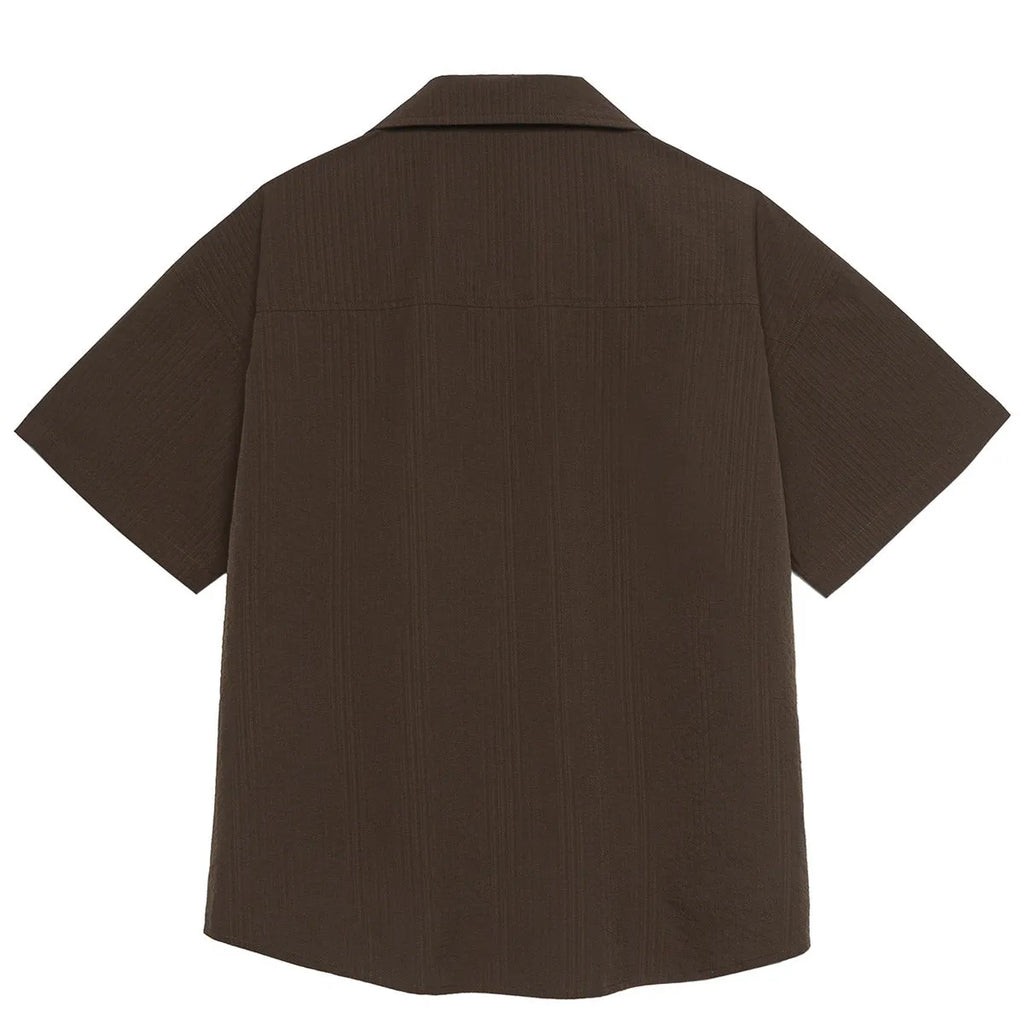 Brown striped men's short sleeve outdoor shirt with Cuban collar on a mannequin.