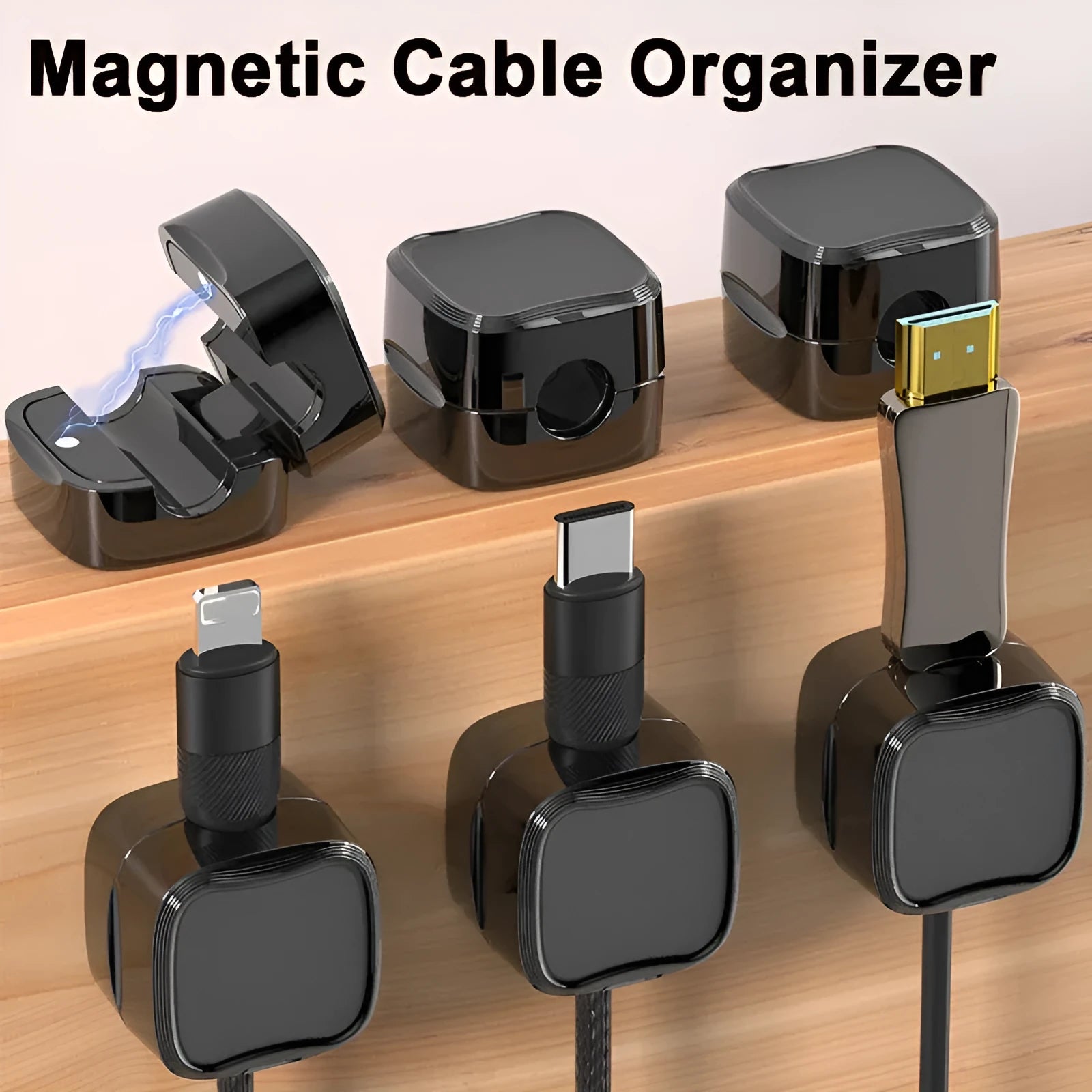 Black and white magnetic cable clips with adhesive backing for under desk cable management.