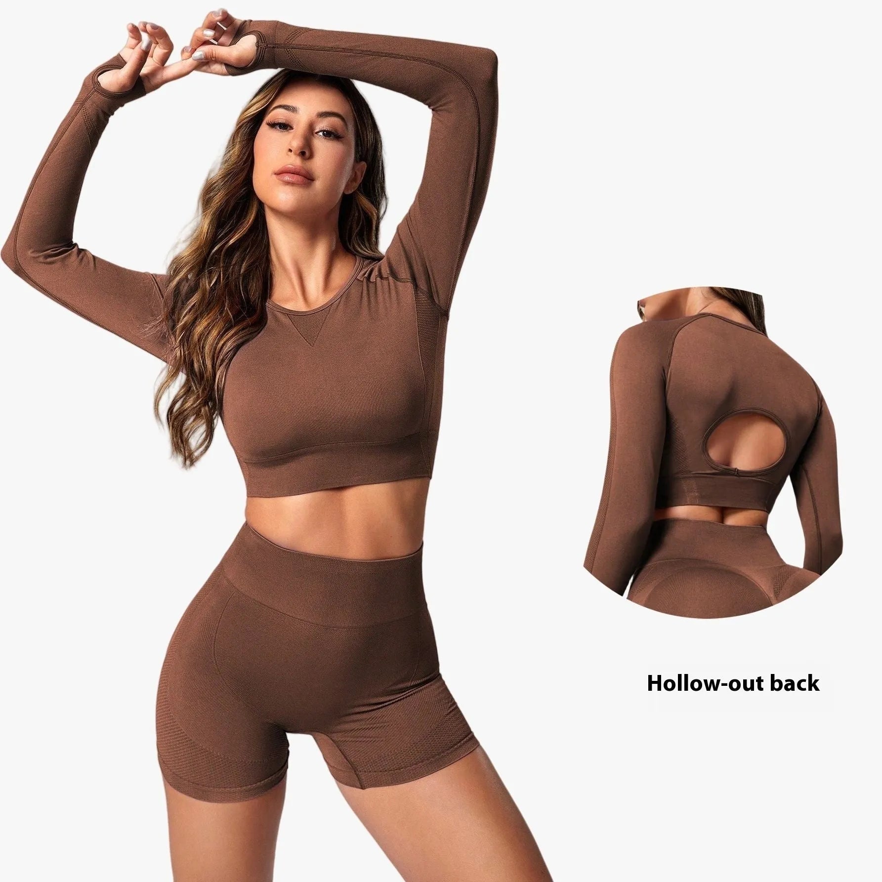 Women's black high-waist yoga pants and long-sleeve top set laid flat.