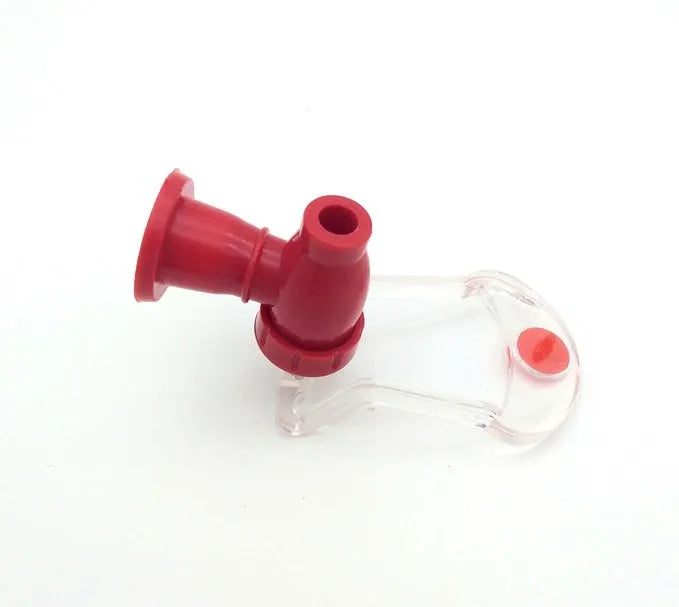 Red plastic Magic Tap soda drink dispenser attached to an inverted 2-litre bottle.