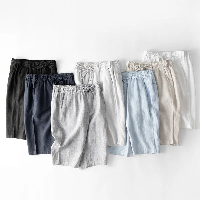 Men's linen capri trousers in loose straight-leg fit showing colour options including white, gray, black and blue tones