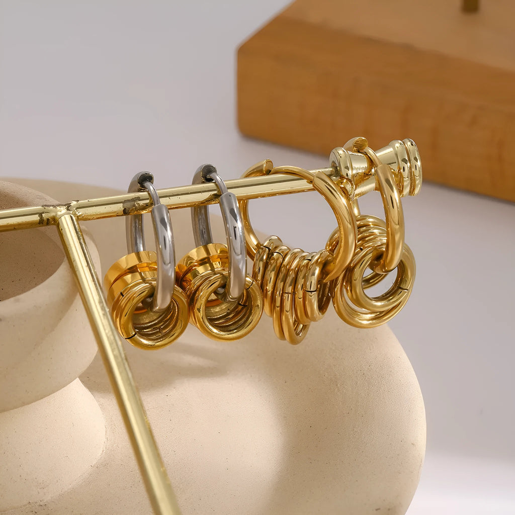 A pair of stainless steel ins style earrings with an electroplated silver or gold tone finish.