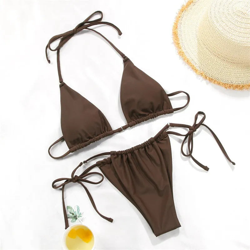 Women's polka dot and floral print split swimsuit bikini set on a mannequin.