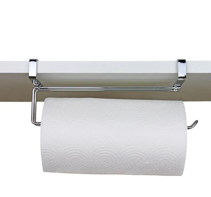 Silver stainless steel kitchen towel rack mounted on a cabinet door holding a paper towel roll.