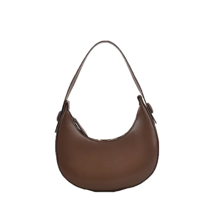 Retro dumpling-shaped women's shoulder bag in PU leather, shown in cream yellow colour.