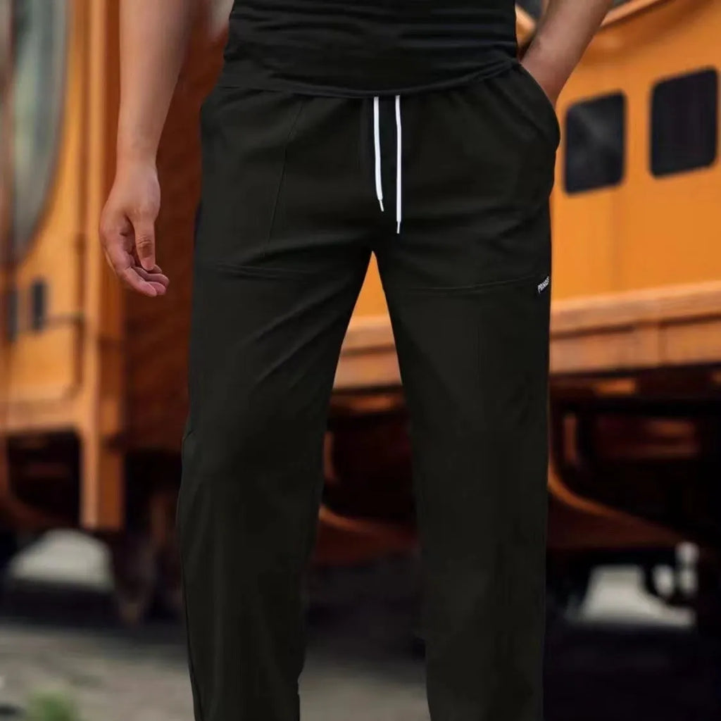 Men's straight-leg polyester trousers in light grey on a hanger