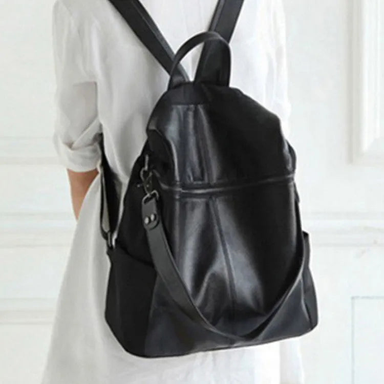 Genuine leather women's retro backpack showing sewing thread details and sandwich pocket