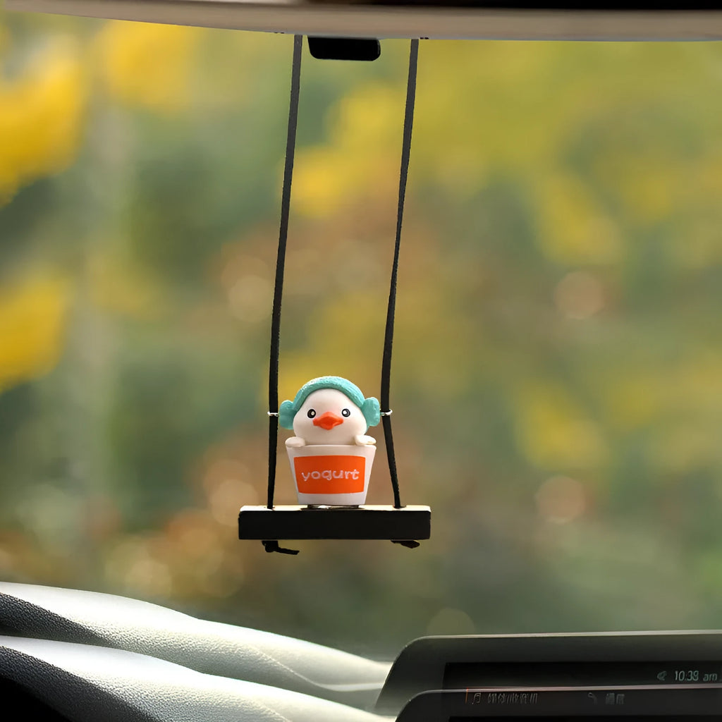 Cute yellow plastic duck doll car hanging ornament in a cartoon style.