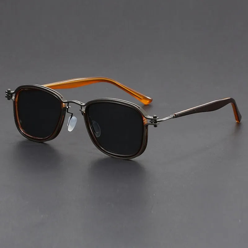 Retro square sunglasses with metal decorative patterns and tinted lenses in a two-tone colour finish.