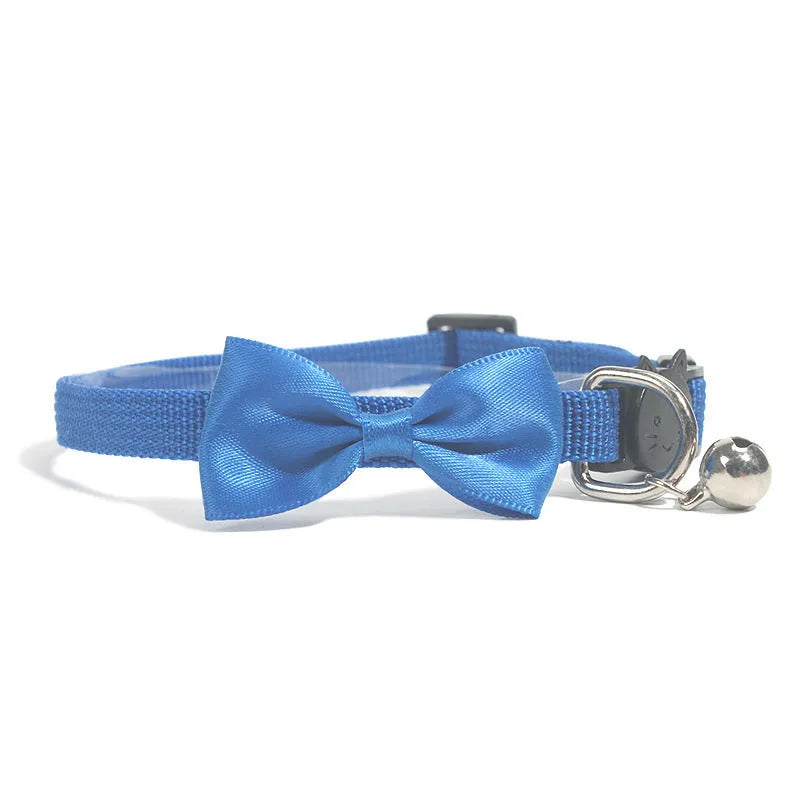 Adjustable striped nylon cat collar with a small silver bell attached, shown in multiple colour options.