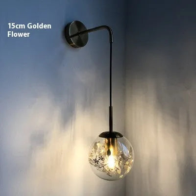 Modern glass wall lamp with LED light in gold or silver finish, shown in 15cm and 20cm sizes.