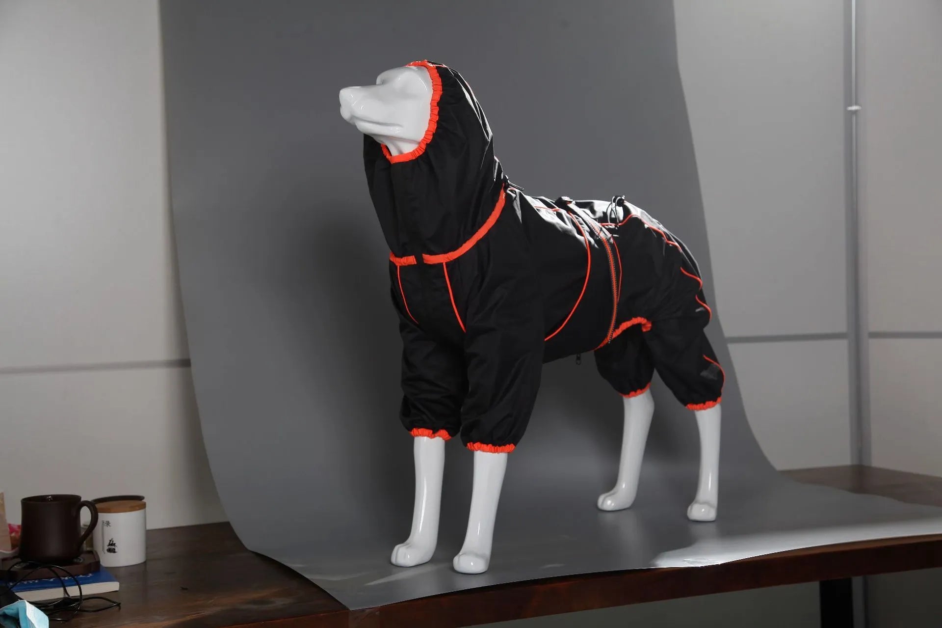 Dog wearing red cotton-padded shell jacket with sports style design