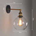 Retro spherical glass wall light fitting with a 20cm diameter, shown in amber tint.