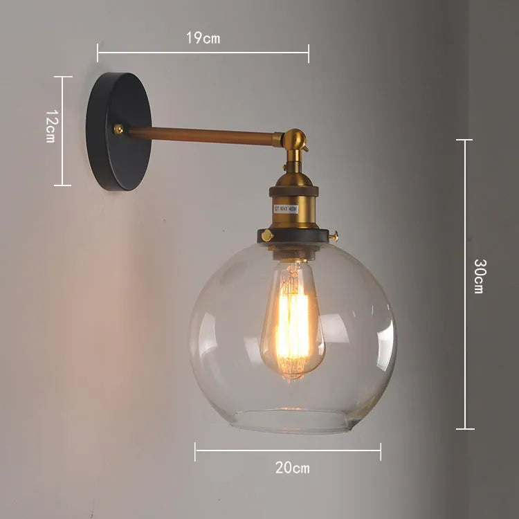 Retro spherical glass wall light fitting with a 20cm diameter, shown in amber tint.