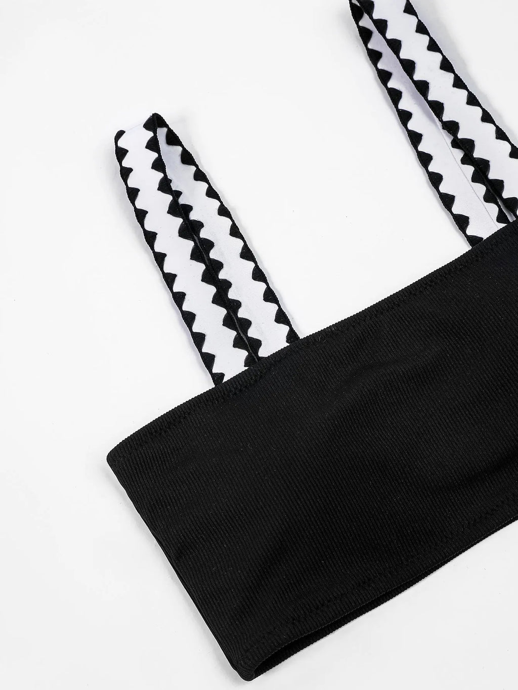 Black women's one-piece swimsuit with hollowed-out split design and briefs cut.