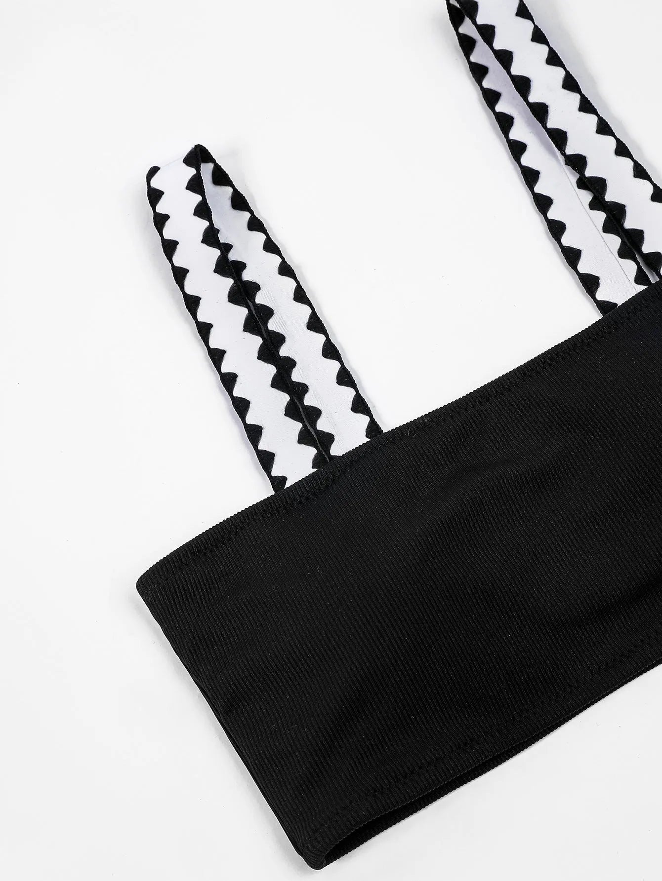 Black women's one-piece swimsuit with hollowed-out split design and briefs cut.