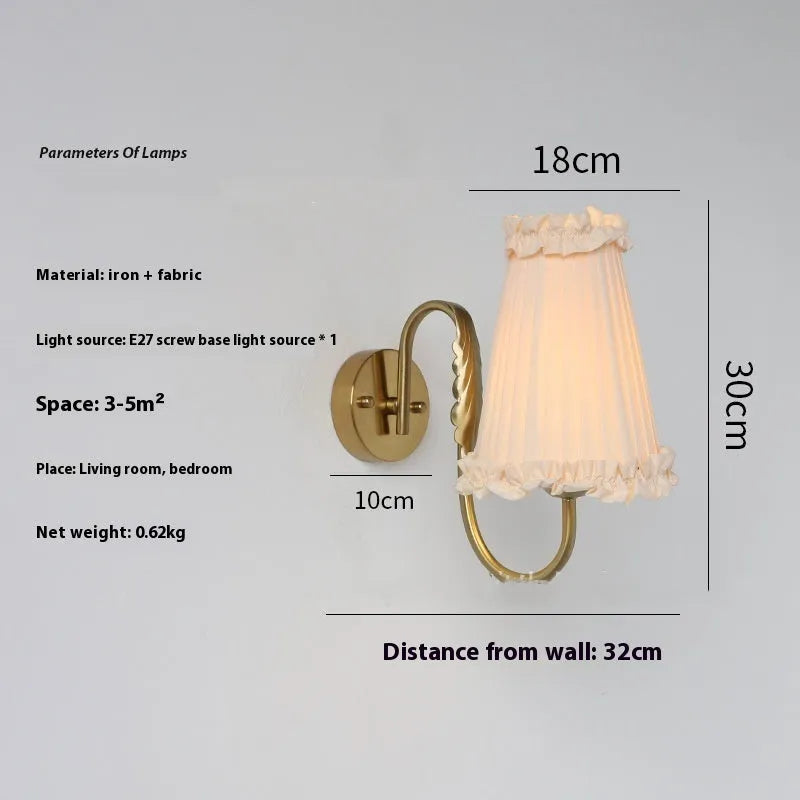 Wheat wall lamp with fabric shade and iron frame mounted on a bedroom wall with warm non-stroboscopic light