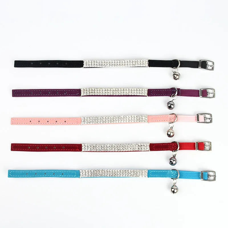 Red velvet cat collar with rhinestones on a white background, showing buckle and adjustable strap.