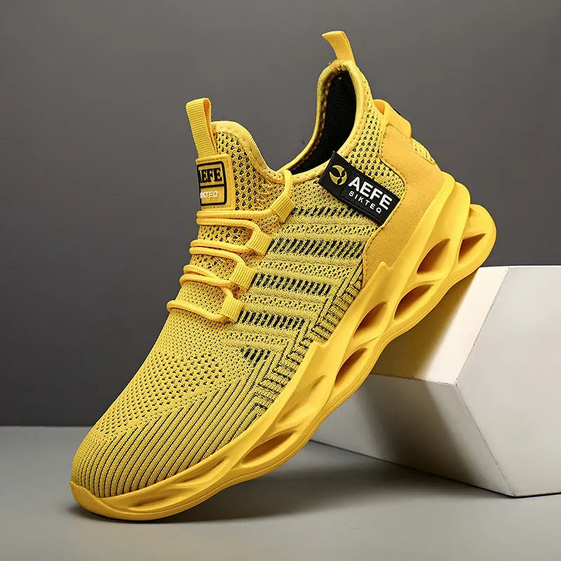Men's casual running shoes with mesh upper in black colour showing cross strap details and low-top design