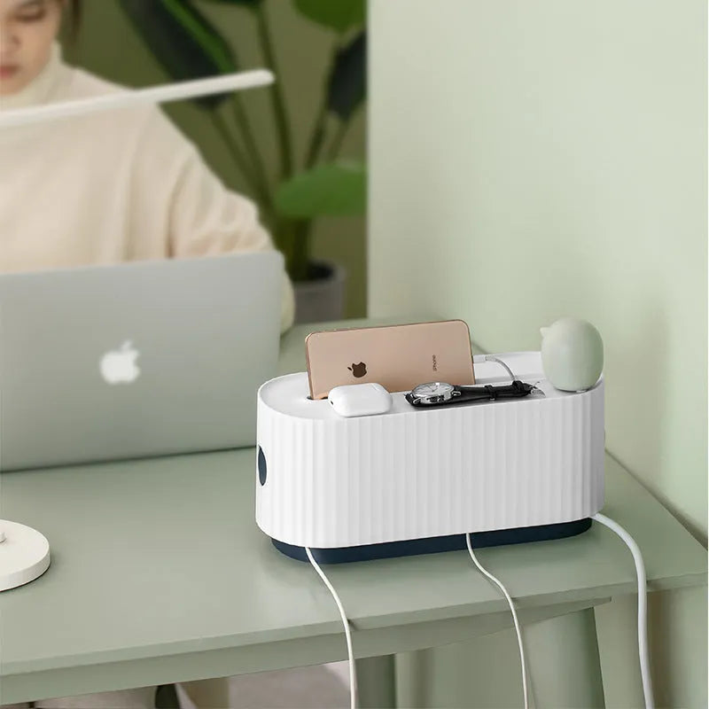 Blue and white power strip storage box with lid open showing cable management holes