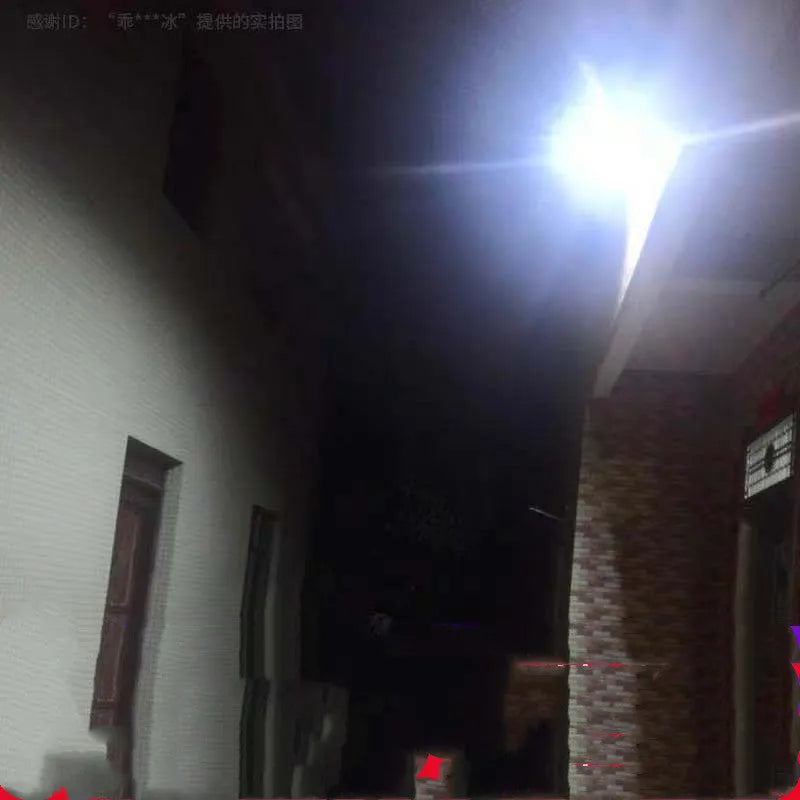 Black solar-powered LED flood light with remote control for garden and outdoor security lighting.