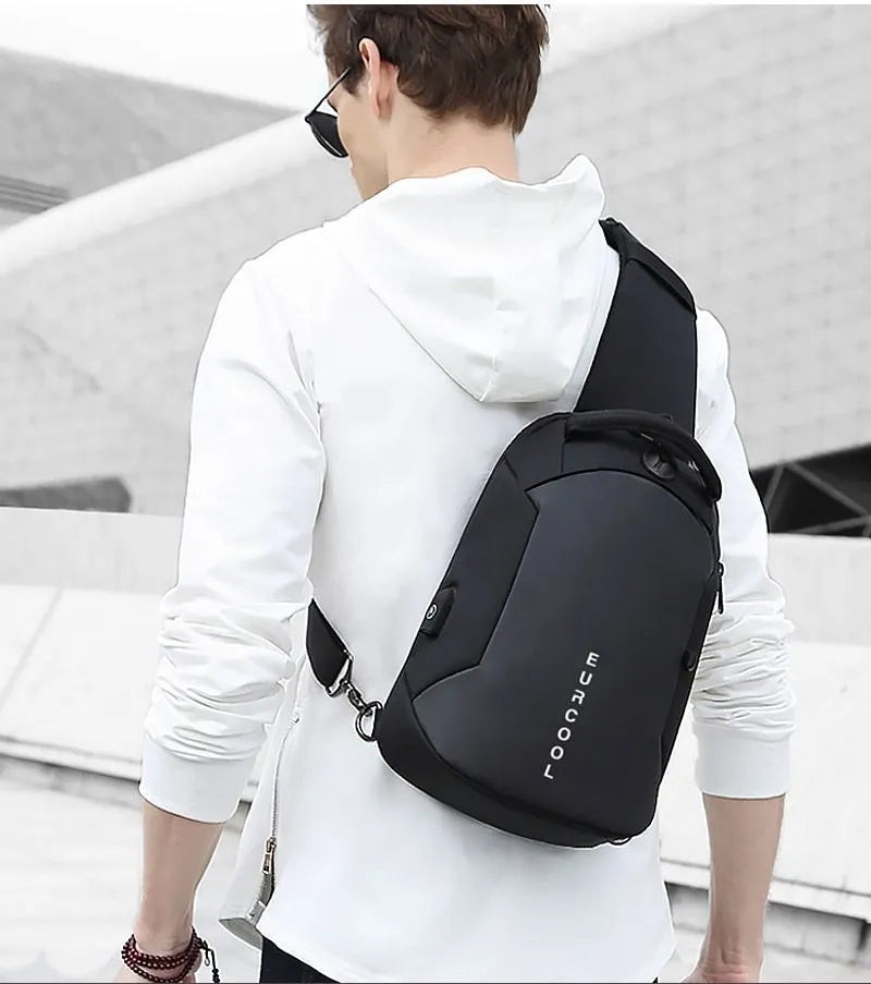 Men's black Oxford crossbody bag with USB charging port and multiple zipped pockets.