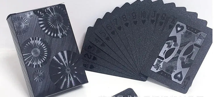 Black Diamond waterproof plastic poker cards with gold foil finish showing laser-etched diamond pattern on black background