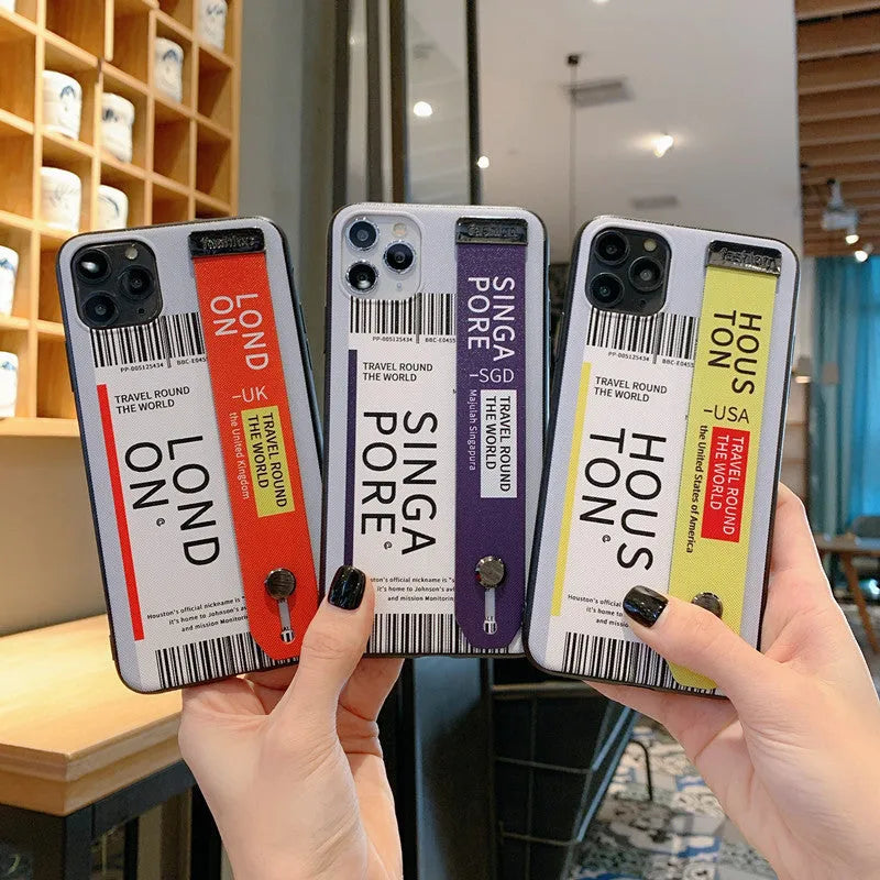 Red labelled TPU and PC mobile phone case for iPhone with an attached fabric wristband.