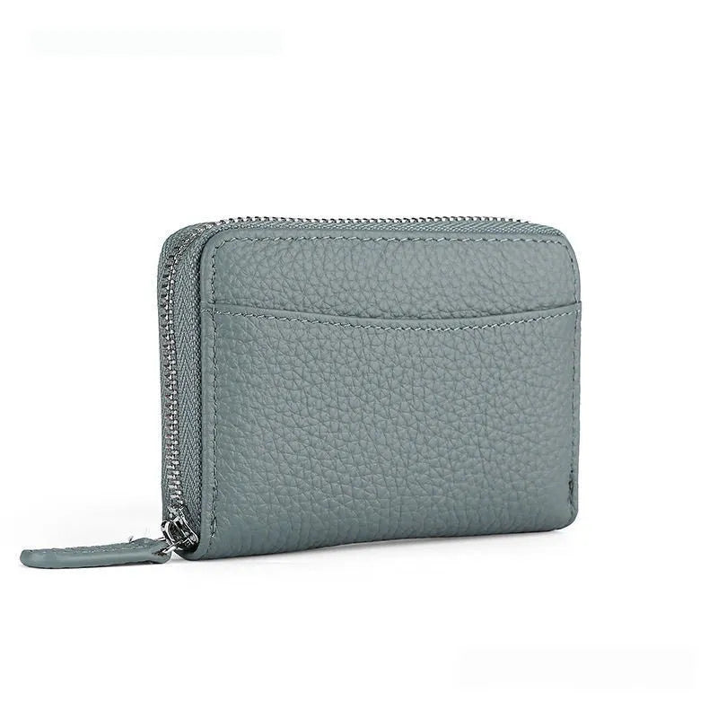 Genuine leather zipper coin purse in solid colour with anti-theft feature and sewing line detail.