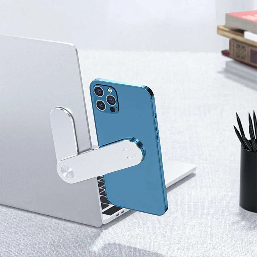 Black aluminium laptop phone holder clipped to side of monitor with smartphone attached.