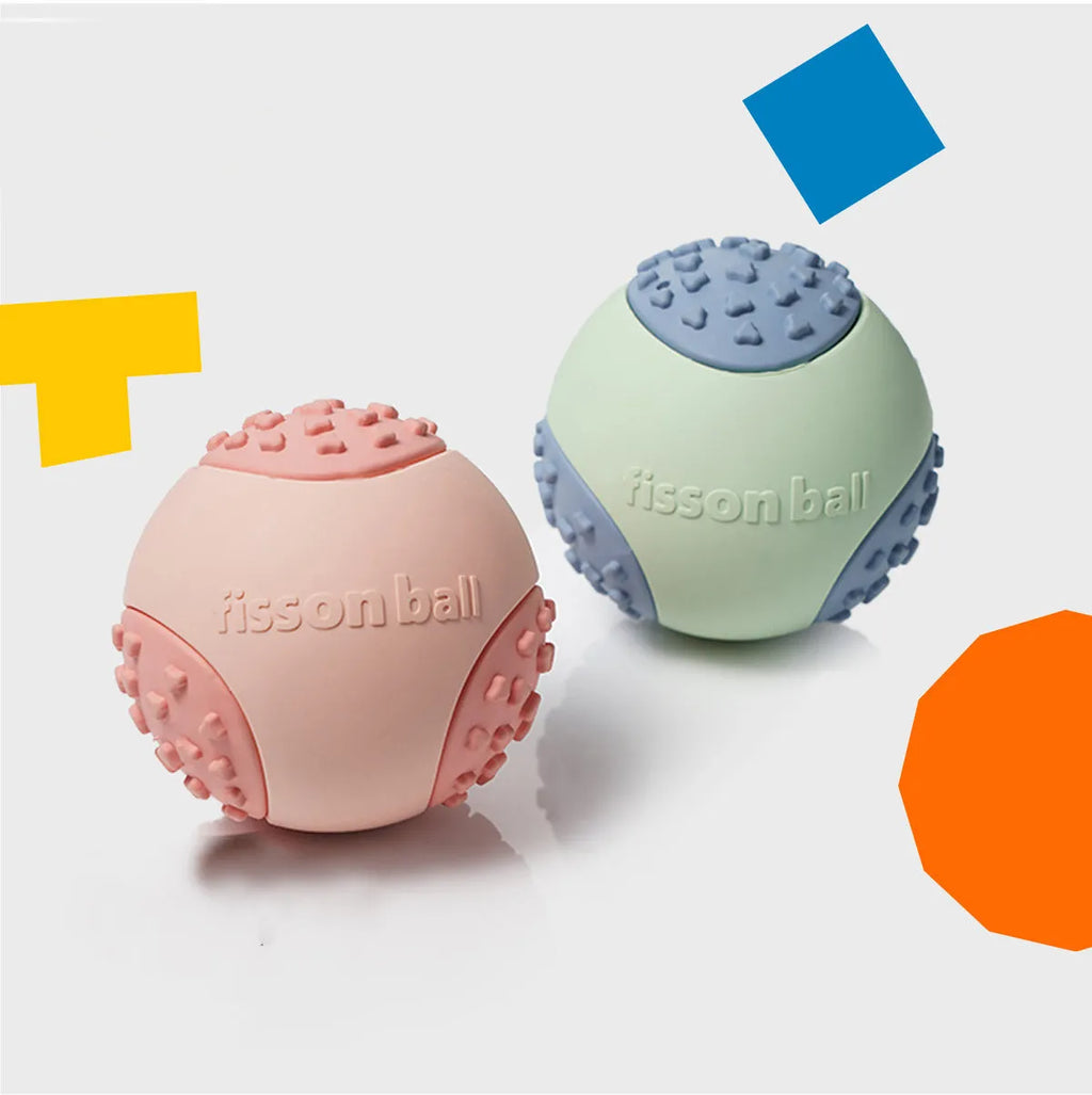 Green and pink durable plastic rolling ball dog toy with 64mm diameter.