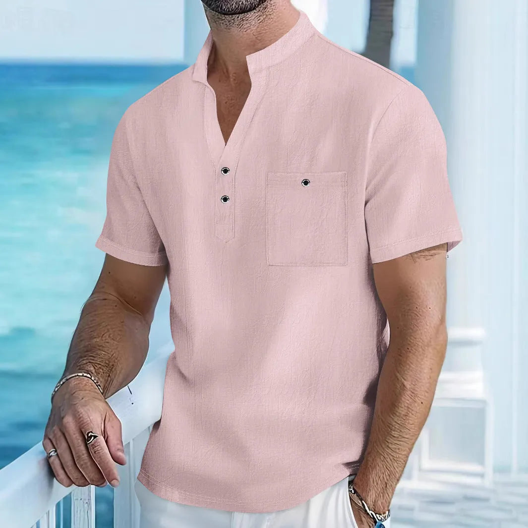 Man wearing a light apricot coloured stand collar linen blend short sleeve t-shirt with a loose fit.
