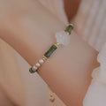Chinese style olivine bamboo joint shell pearls bracelet with Hetian jade and copper detailing